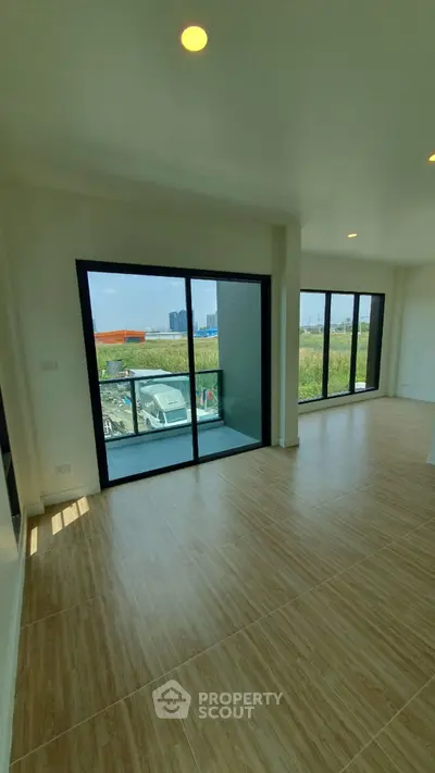 Spacious corner unit with large windows and balcony offering stunning views.