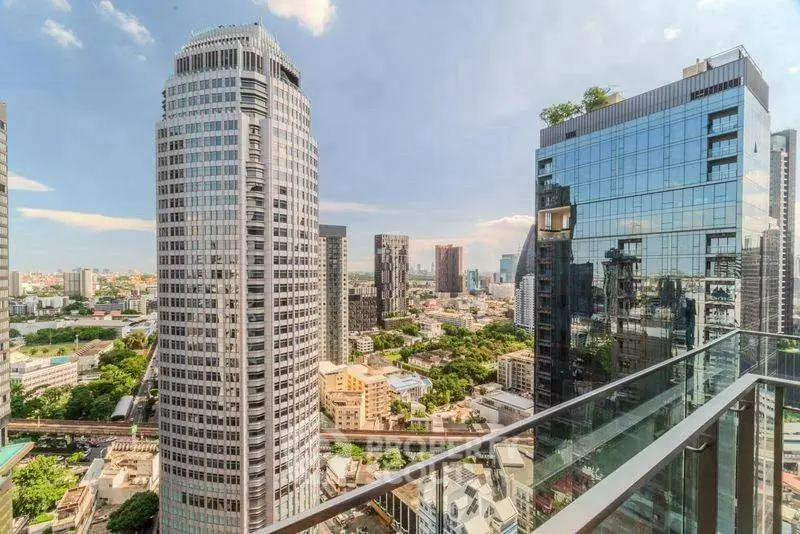 Stunning cityscape view from a modern high-rise balcony in urban setting.