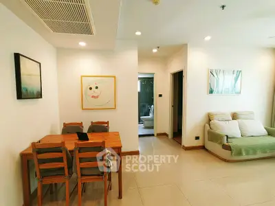 Spacious living room with dining area and modern decor in a cozy apartment