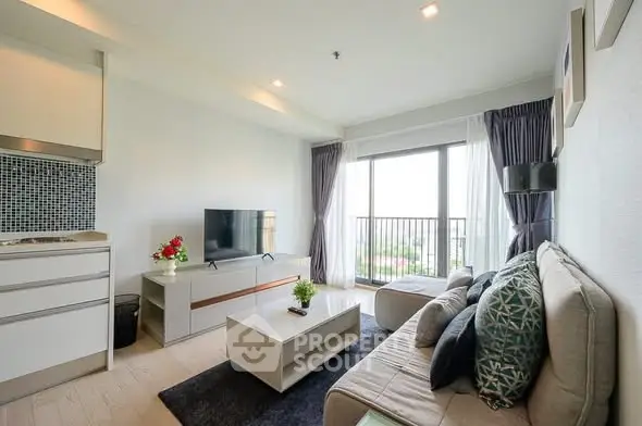 Modern living room with stylish decor and balcony view in a contemporary apartment.