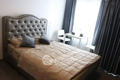 Cozy bedroom with elegant tufted headboard and natural light