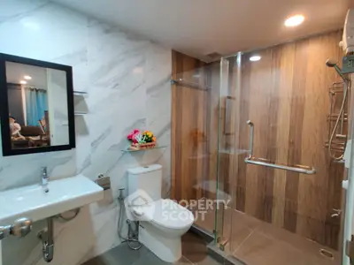 Modern bathroom with glass shower and sleek fixtures