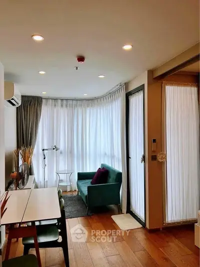 Modern living room with floor-to-ceiling windows and stylish decor