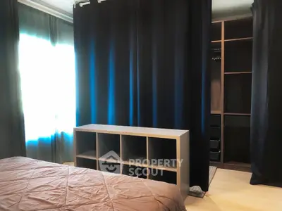 Cozy bedroom with walk-in closet and modern storage solutions.