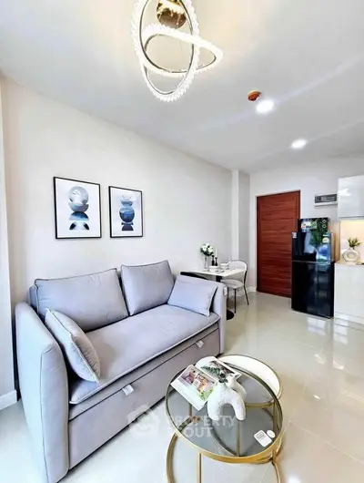 Modern living room with stylish decor, cozy sofa, and elegant lighting in a contemporary apartment.