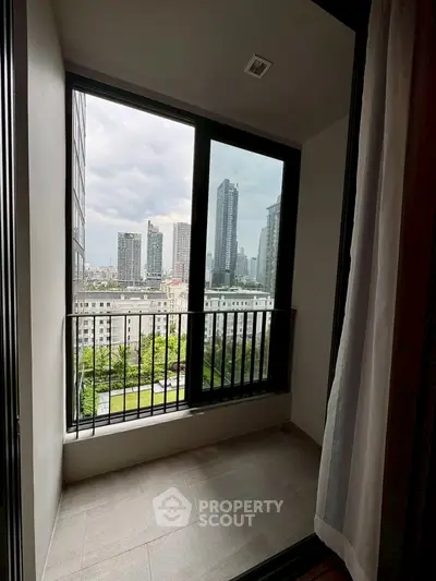 Cozy balcony with stunning cityscape view in modern apartment