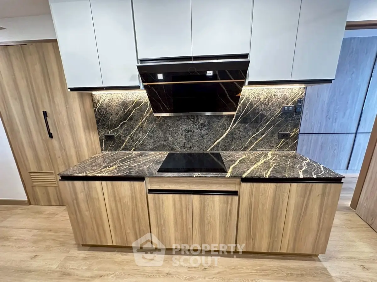 Modern kitchen with sleek cabinetry and elegant marble countertops
