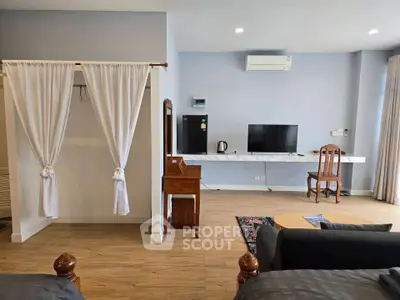 Spacious living room with modern amenities and elegant decor