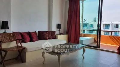 Spacious living room with elegant decor and large windows offering a stunning view.