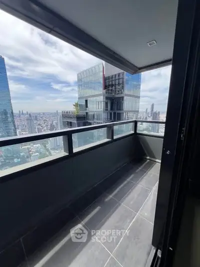 Stunning cityscape view from a modern high-rise balcony, perfect for urban living.