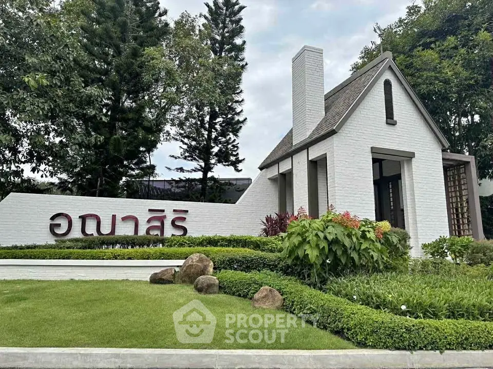Charming modern house exterior with lush landscaping and unique architectural design.