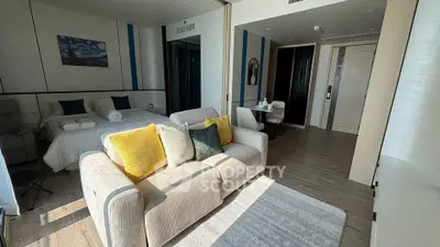 Modern studio apartment with cozy living area and stylish decor