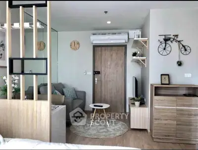 Modern living room with stylish decor and air conditioning in a cozy apartment.