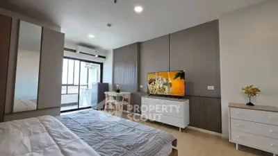 Spacious modern bedroom with balcony access and stylish decor