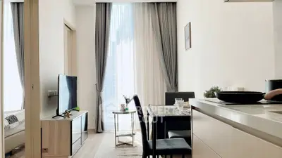 Modern living room with dining area and large window in stylish apartment