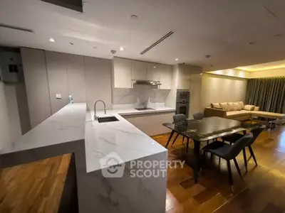 Luxurious modern kitchen with marble countertops and open layout in stylish apartment