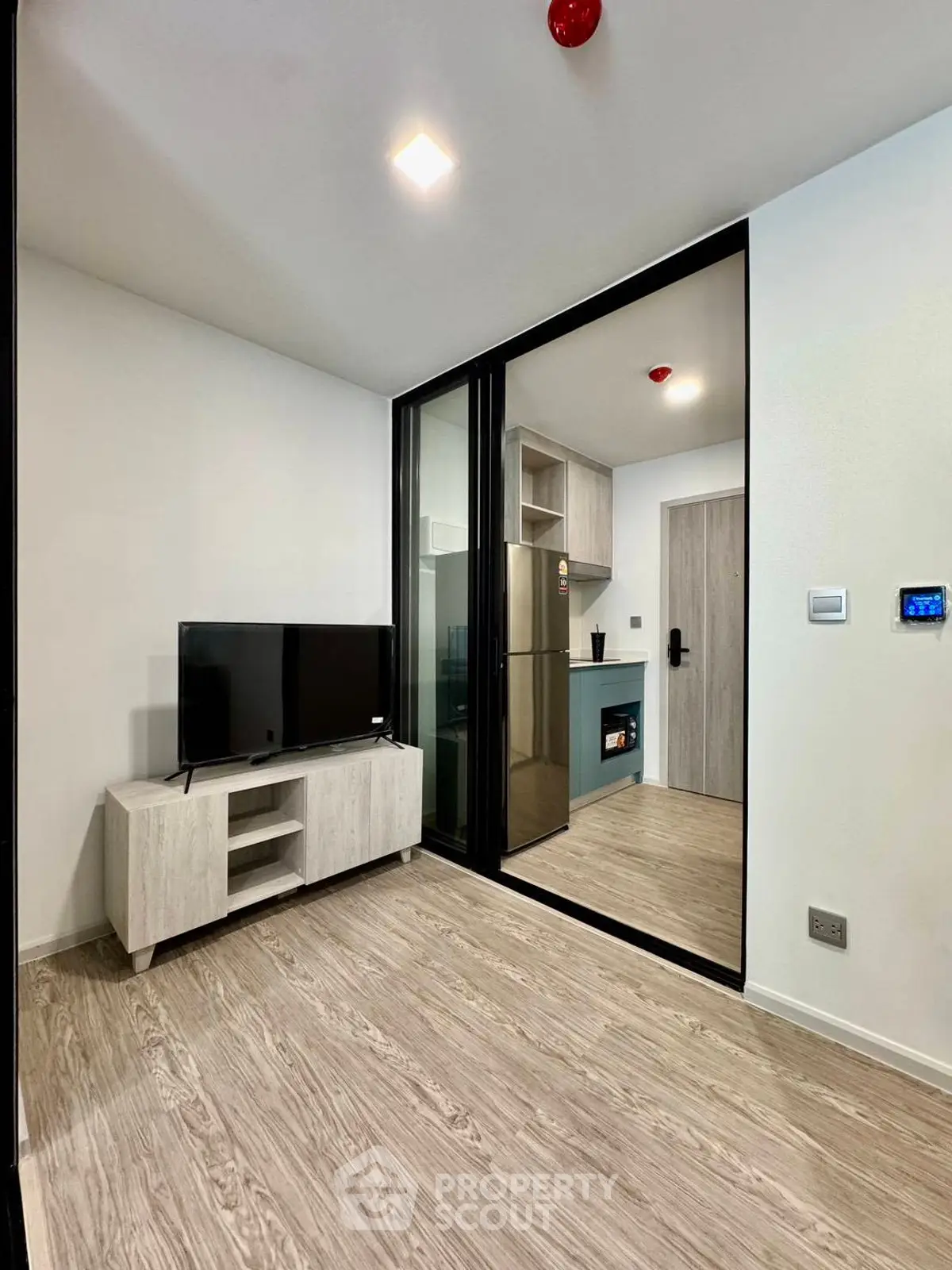 Modern living room with sleek design and open kitchen layout