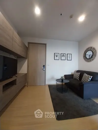 Modern living room with stylish decor and cozy seating area.