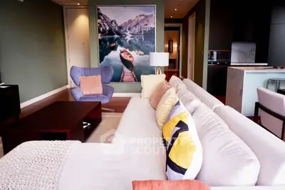 Luxurious living room with modern decor and stunning wall art in a stylish apartment.