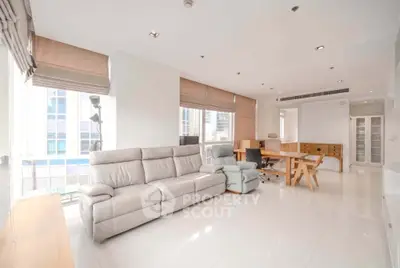 Spacious modern living room with elegant furniture and large windows