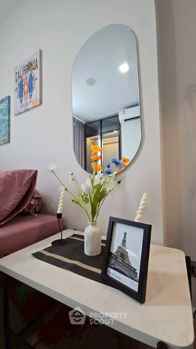 Stylish modern living room with chic decor and elegant mirror