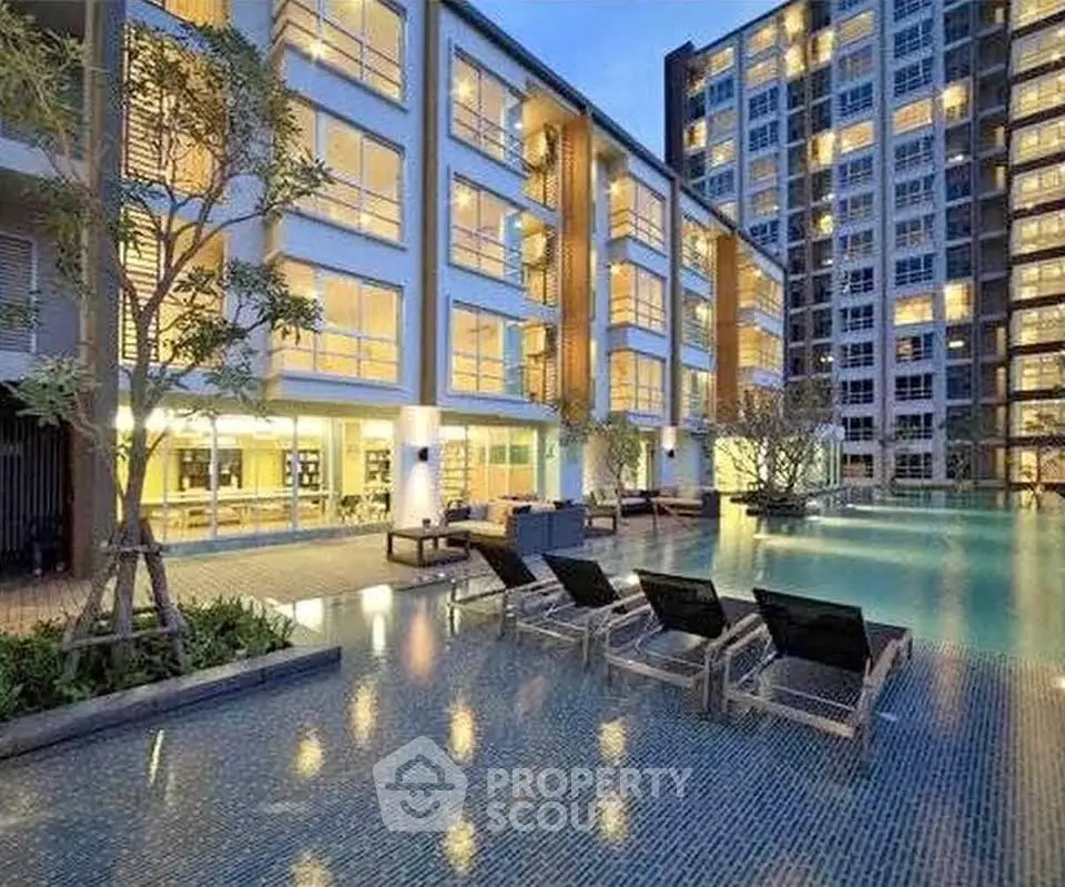 Luxurious apartment complex with stunning poolside view and modern architecture.