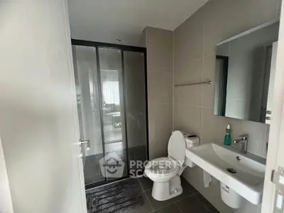 Modern bathroom with sleek design and glass shower enclosure