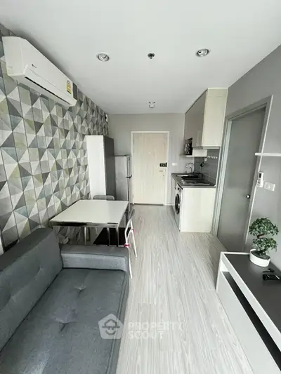 Modern apartment interior with stylish living room and compact kitchen