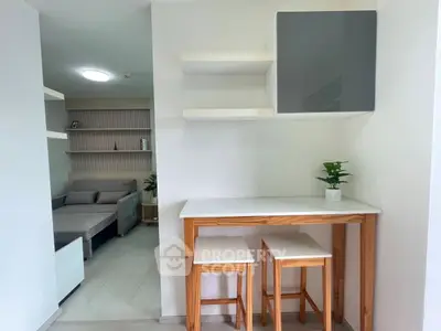 Modern interior with minimalist dining area and cozy living room in open layout apartment.