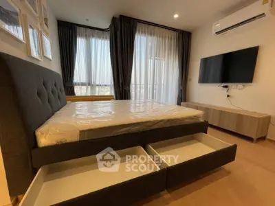 Modern bedroom with large windows and built-in storage bed