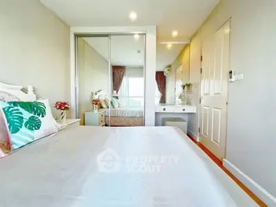 Bright and airy bedroom with mirrored closet and elegant decor