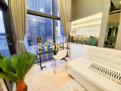 Modern living room with large windows and stylish decor in urban apartment.