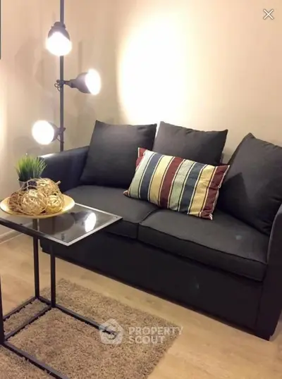 Cozy living room with stylish sofa and modern lighting