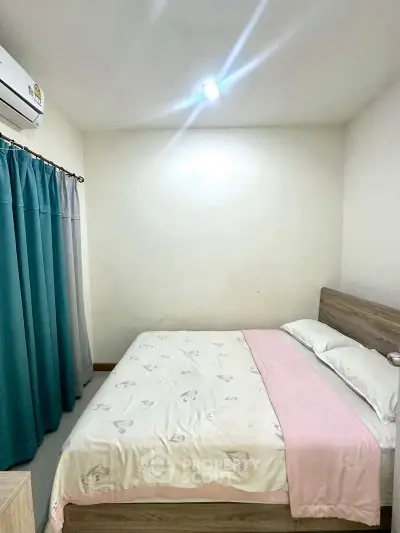 Cozy bedroom with soft lighting and modern decor, featuring a comfortable bed and stylish curtains.