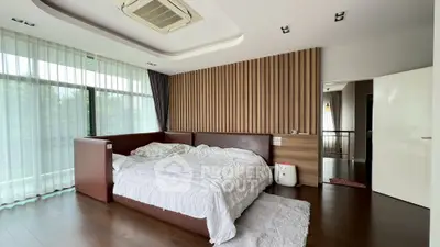 Luxurious bedroom with modern design and large windows for natural light