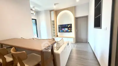 Modern living room with stylish furniture and built-in entertainment center