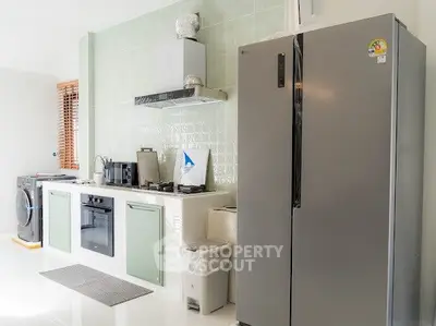 Modern kitchen with sleek appliances and stylish cabinetry