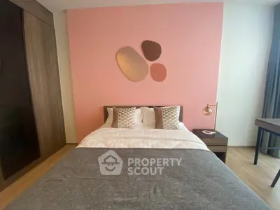 Modern bedroom with stylish decor and cozy ambiance, featuring a comfortable bed and elegant furnishings.