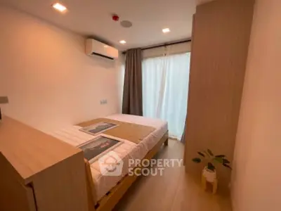 Cozy modern bedroom with natural light and minimalist decor