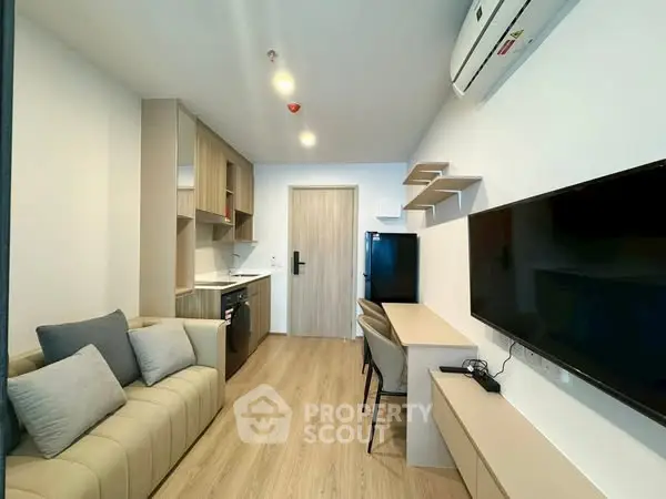 Modern studio apartment with stylish furniture and open kitchen layout.