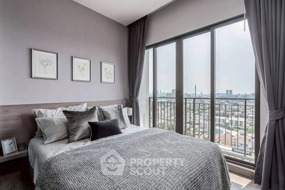 Modern bedroom with large windows and city view, featuring stylish decor and cozy ambiance.
