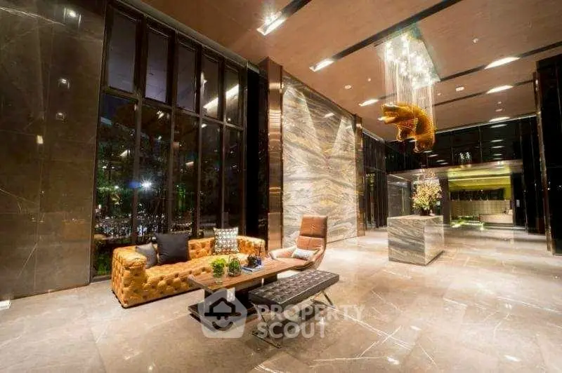 Luxurious modern lobby with elegant seating and stunning chandelier
