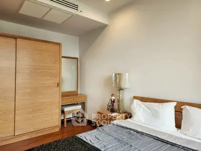 Modern bedroom with wooden furniture and cozy decor