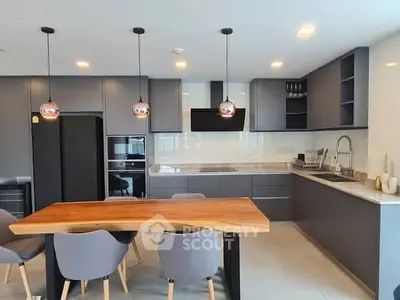 Modern kitchen with sleek cabinetry and stylish dining area
