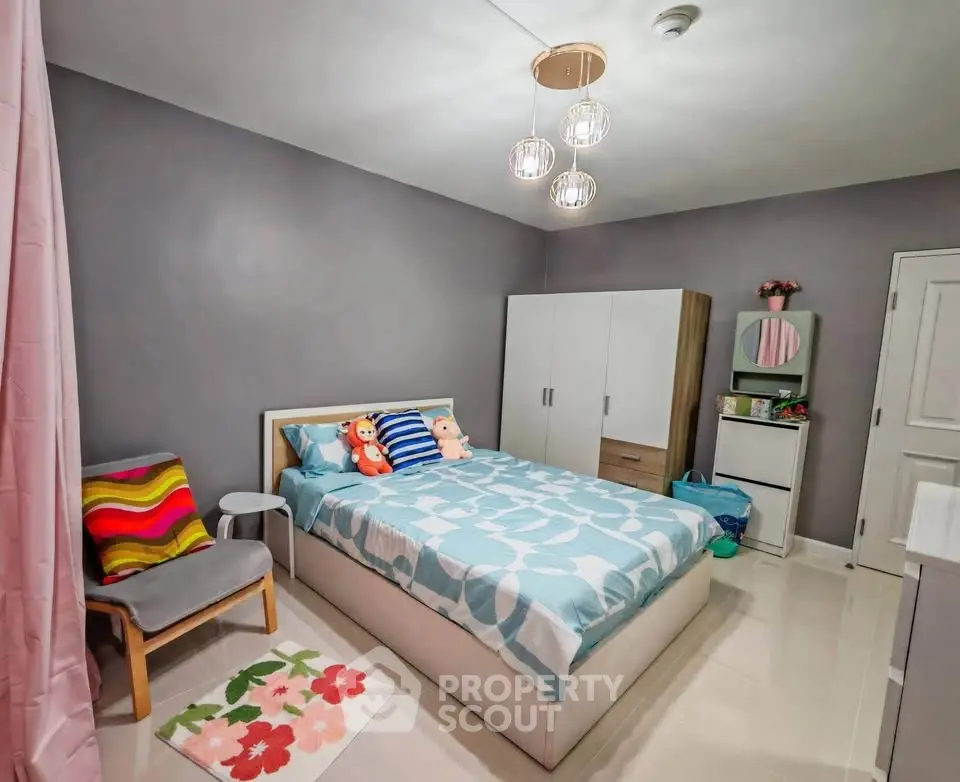 Cozy bedroom with modern decor and ample storage space