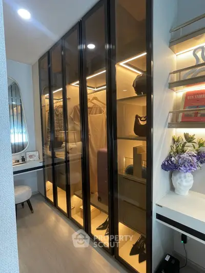 Luxurious walk-in closet with elegant lighting and modern design