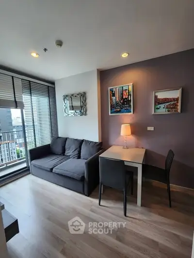 Modern living room with stylish decor and city view balcony