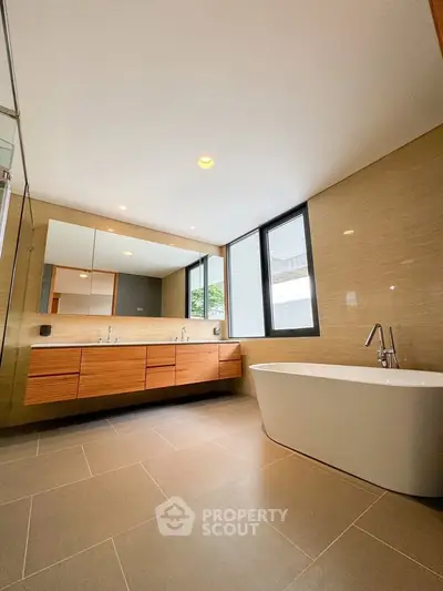 Luxurious modern bathroom with freestanding tub and dual sinks