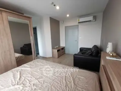 Modern bedroom with mirrored wardrobe and air conditioning in stylish apartment