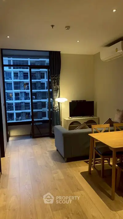 Modern living room with balcony view in urban apartment